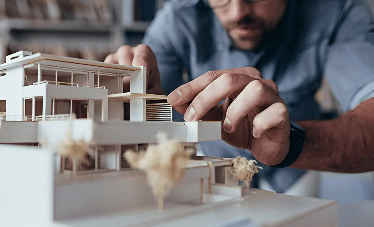 An Architect Customizing a Scaled Architectural Model An Architect Customizing a Scaled Architectural Model